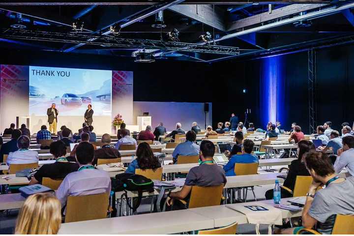 A conference room with attendees seated, watching a speaker on stage with a "Thank You" slide on the screen.© NürnbergMesse / Heiko Stahl